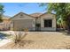 Well-maintained single-story house featuring low-maintenance desert landscaping and a neutral color palette at 9343 W Harmony Ln, Peoria, AZ 85382