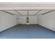 This is a garage with gray floors, white walls, and an open entrance at 9343 W Harmony Ln, Peoria, AZ 85382