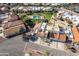 An aerial view of the terracotta-roofed property featuring a backyard pool and well-manicured landscaping at 943 E Kortsen Rd # 2, Casa Grande, AZ 85122