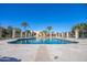 Large community pool with a clear blue water, set against a sunny blue sky at 943 E Kortsen Rd # 2, Casa Grande, AZ 85122