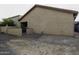 Exterior view of the backyard featuring a block fence and low maintenance desert landscaping at 943 E Kortsen Rd # 2, Casa Grande, AZ 85122