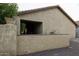 Exterior view of block fence and desert landscaping, providing privacy and low maintenance at 943 E Kortsen Rd # 2, Casa Grande, AZ 85122