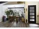 Bright dining room with a wooden table, eclectic decor, and a cozy atmosphere at 943 E Kortsen Rd # 2, Casa Grande, AZ 85122