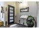 Stylish entryway featuring a modern door, decorative mirror, and unique design elements at 943 E Kortsen Rd # 2, Casa Grande, AZ 85122