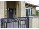 Up-close look at the gated front entrance with a stylish front door and desert-style landscaping at 943 E Kortsen Rd # 2, Casa Grande, AZ 85122