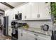 Bright kitchen features white cabinetry, subway tile backsplash, stainless steel appliances, and granite countertops at 943 E Kortsen Rd # 2, Casa Grande, AZ 85122