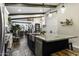 Open concept kitchen features a large island with stainless steel sink, granite countertops, and modern pendant lighting at 943 E Kortsen Rd # 2, Casa Grande, AZ 85122