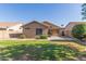 Spacious backyard with grassy area, patio, and mature landscaping at 1058 W Swan Dr, Chandler, AZ 85286