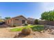 Well-maintained backyard with lush lawn, mature trees and shrubs at 1058 W Swan Dr, Chandler, AZ 85286
