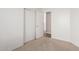 Bedroom featuring light carpet, walls, and a glimpse into an adjacent room at 1058 W Swan Dr, Chandler, AZ 85286