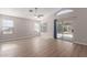 Bright living room featuring wood flooring, high ceilings, and sliding glass doors at 1058 W Swan Dr, Chandler, AZ 85286