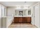 A primary bathroom featuring a double vanity, soaking tub and a glass enclosed shower at 11129 E Reginald Ave, Mesa, AZ 85212