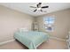 Comfortable bedroom with natural light and neutral colors, creating a calming atmosphere at 11129 E Reginald Ave, Mesa, AZ 85212