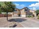 Two-story home features a two-car garage, neutral stucco, desert landscaping, and a concrete driveway at 11129 E Reginald Ave, Mesa, AZ 85212