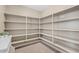 Spacious walk-in pantry featuring ample shelving for organized storage at 11129 E Reginald Ave, Mesa, AZ 85212