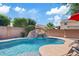 Inviting pool area with a rock waterfall slide, perfect for outdoor fun at 11129 E Reginald Ave, Mesa, AZ 85212