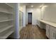 Bright bathroom features a walk-in shower, spacious shelving and modern vanity with dual sinks at 11796 N Vanero Ct, Maricopa, AZ 85139