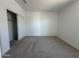 Bedroom with neutral carpet and closet offering ample storage space at 11796 N Vanero Ct, Maricopa, AZ 85139