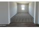 This cozy carpeted bedroom features a window letting in natural light and neutral walls at 11796 N Vanero Ct, Maricopa, AZ 85139
