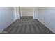 This cozy carpeted bedroom features a window letting in natural light and neutral walls at 11796 N Vanero Ct, Maricopa, AZ 85139