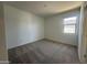 Bedroom with neutral carpet and window providing ample natural light at 11796 N Vanero Ct, Maricopa, AZ 85139