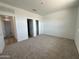 This bedroom has carpet, a closet with double doors, and a hallway entrance at 11796 N Vanero Ct, Maricopa, AZ 85139