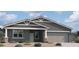 Beautiful single story home with neutral color scheme, a covered porch, and a two car garage at 11796 N Vanero Ct, Maricopa, AZ 85139