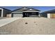 Charming single-story home featuring a two car garage and xeriscape front yard at 11796 N Vanero Ct, Maricopa, AZ 85139