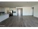 Bright, open living area connecting the kitchen, offering a modern layout for easy living at 11796 N Vanero Ct, Maricopa, AZ 85139