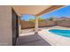 Backyard features covered patio and partial view of pool at 11805 W Sunnyside Dr, El Mirage, AZ 85335