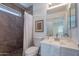Updated bathroom with tiled shower and vanity with sink at 11805 W Sunnyside Dr, El Mirage, AZ 85335