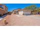 Inviting single-story home featuring a two-car garage, low maintenance yard, and desert landscaping at 11805 W Sunnyside Dr, El Mirage, AZ 85335