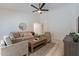 Cozy living room showcasing neutral tones, vaulted ceilings, and stylish decor at 11805 W Sunnyside Dr, El Mirage, AZ 85335