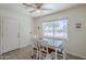 Sunlit dining area features a large window, stylish table, and charming decor, creating an inviting and comfortable eating space at 120 S Olive --, Mesa, AZ 85204