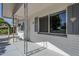 Inviting front porch with decorative railings, seating area, and charming curb appeal at 120 S Olive --, Mesa, AZ 85204