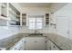Modern kitchen showcasing granite countertops, a sink, and neutral tones, offering a functional space at 120 S Olive --, Mesa, AZ 85204