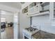 Traditional kitchen featuring white appliances and granite countertops, providing a functional cooking space at 120 S Olive --, Mesa, AZ 85204