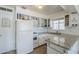 Functional kitchen with white cabinets, granite countertops and stainless appliances, perfect for meal prep and storage at 120 S Olive --, Mesa, AZ 85204