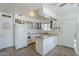 Bright kitchen featuring white cabinetry, granite counters, and stainless steel appliances providing a functional cooking space at 120 S Olive --, Mesa, AZ 85204