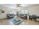 Cozy living room with two sofas, a coffee table, and natural light from the windows at 120 S Olive --, Mesa, AZ 85204