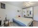 Studio features a white brick wall, full-size mirror, ceiling fan, bed, and wall air conditioning at 120 S Olive --, Mesa, AZ 85204