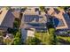 Aerial view of a home with a basketball court, solar panels, and green lawn in the backyard at 1217 W Fever Tree Ave, San Tan Valley, AZ 85140