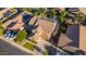 Aerial view of home with solar panels, pool and a well manicured yard at 1217 W Fever Tree Ave, San Tan Valley, AZ 85140