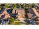 Aerial view of a home with a basketball court, solar panels, and green lawn in the backyard at 1217 W Fever Tree Ave, San Tan Valley, AZ 85140