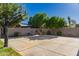 This home features a beautiful backyard with a basketball court and seating area at 1217 W Fever Tree Ave, San Tan Valley, AZ 85140