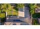 Aerial view of a backyard with a basketball court, lawn, and solar panels at 1217 W Fever Tree Ave, San Tan Valley, AZ 85140