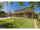 Spacious backyard featuring a basketball court and a covered patio for outdoor activities and relaxation at 1217 W Fever Tree Ave, San Tan Valley, AZ 85140