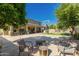 Expansive backyard with a sports court, mature trees, and covered patio for relaxation and entertainment at 1217 W Fever Tree Ave, San Tan Valley, AZ 85140