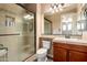 Bathroom featuring a glass-enclosed shower and single vanity sink with tiled countertop at 1217 W Fever Tree Ave, San Tan Valley, AZ 85140