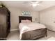 Cozy bedroom with ample natural light, a bed with stylish headboard, and warm neutral tones at 1217 W Fever Tree Ave, San Tan Valley, AZ 85140